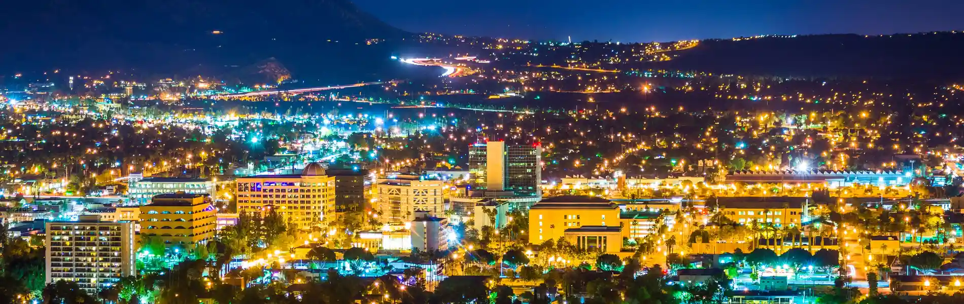 Neon color image of a band playing and people singing along