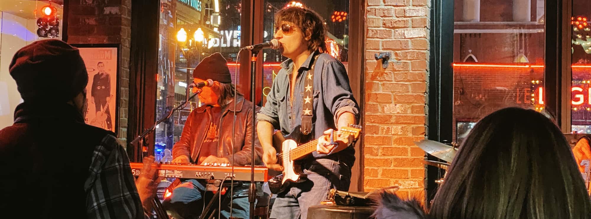 bar singer on guitar in Inland Empire